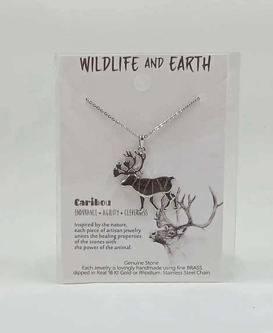 Animal necklace: made of brass, dipped in rhodium is in the shape of a caribou and filled with tigers eye gem stones.