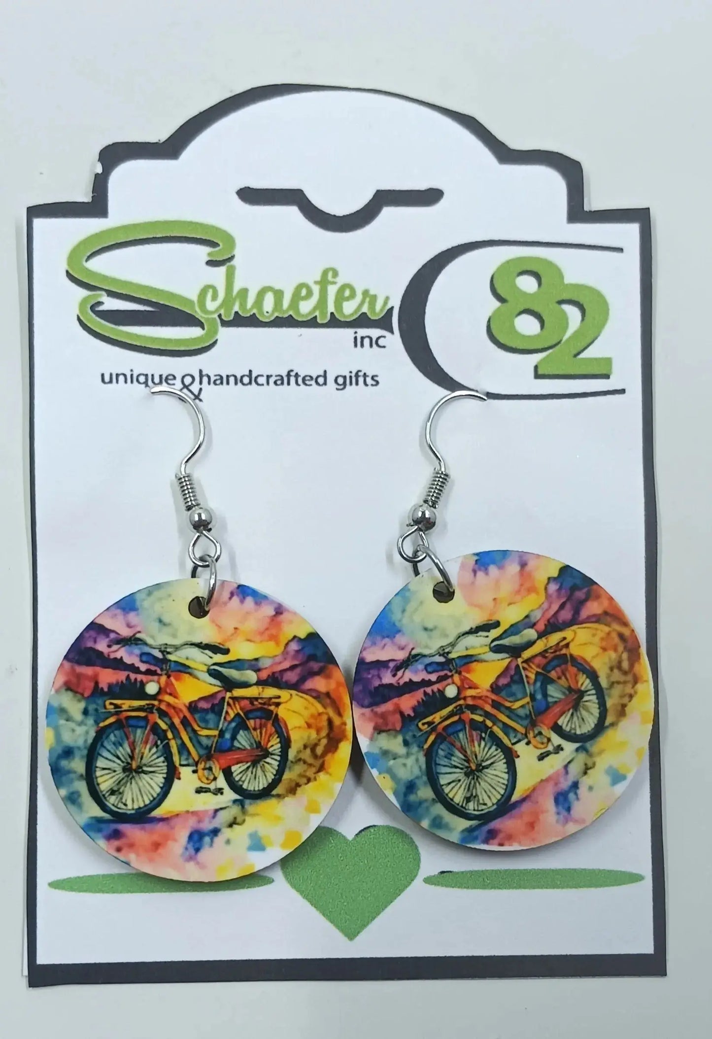 These bike earrings are beautiful. They are handcrafted, circular earrings which have a rainbow background with a detailed bike in the forefront. They are bright and fun!