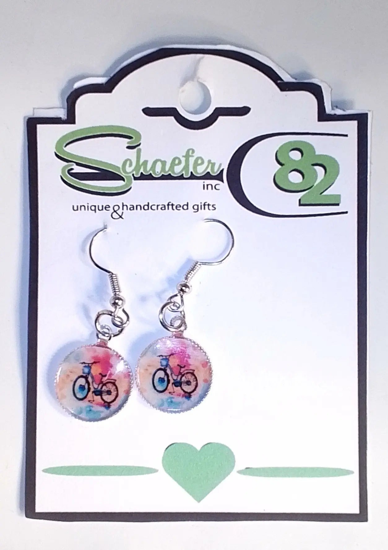 Bike Earrings with a colorful background and covered in Resin:round the mountain gift shop