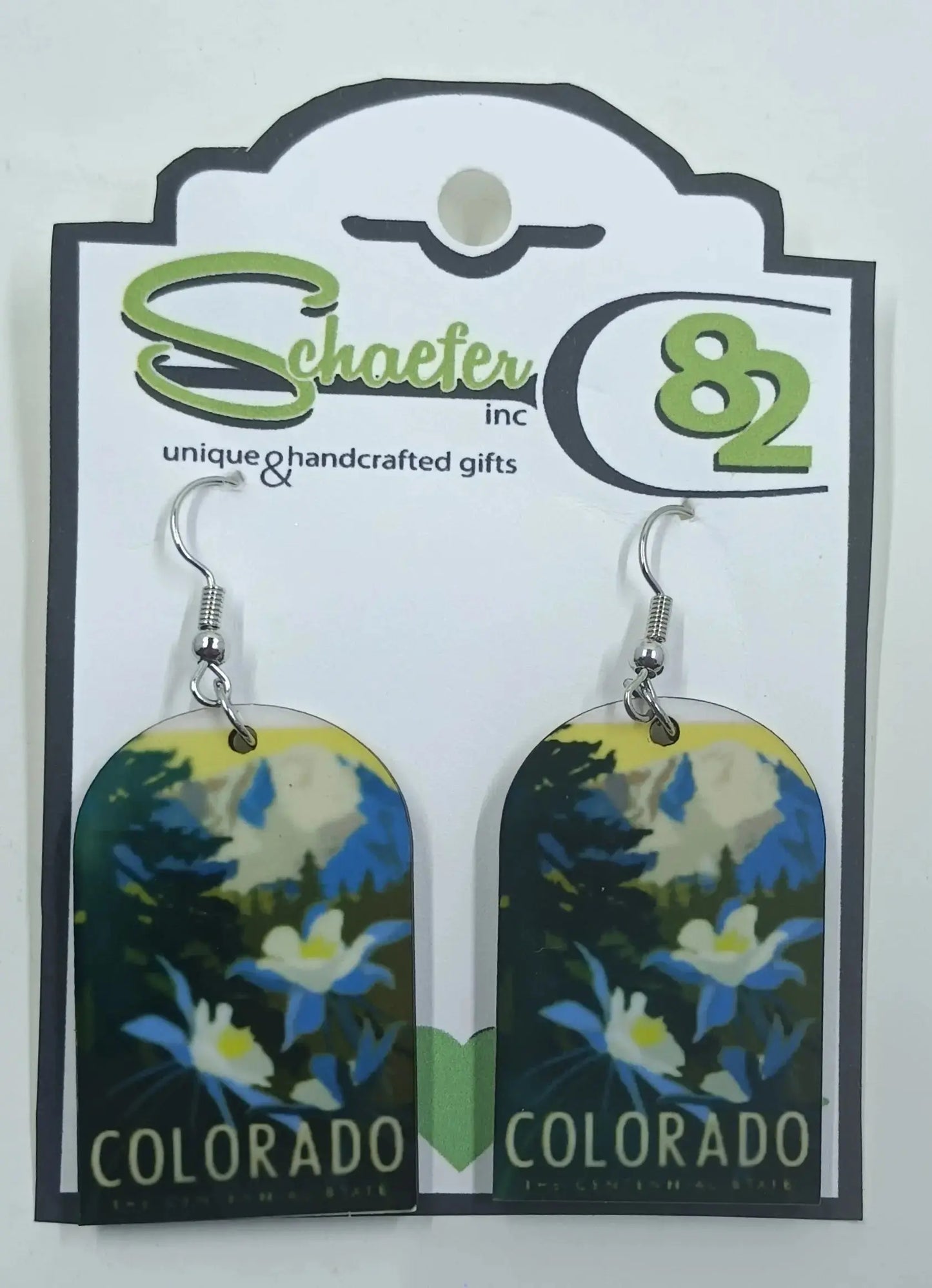 Colorado Earrings that have beautiful mountains and columbine flowers. It says Colorado across the bottom:round the mountain gift shop