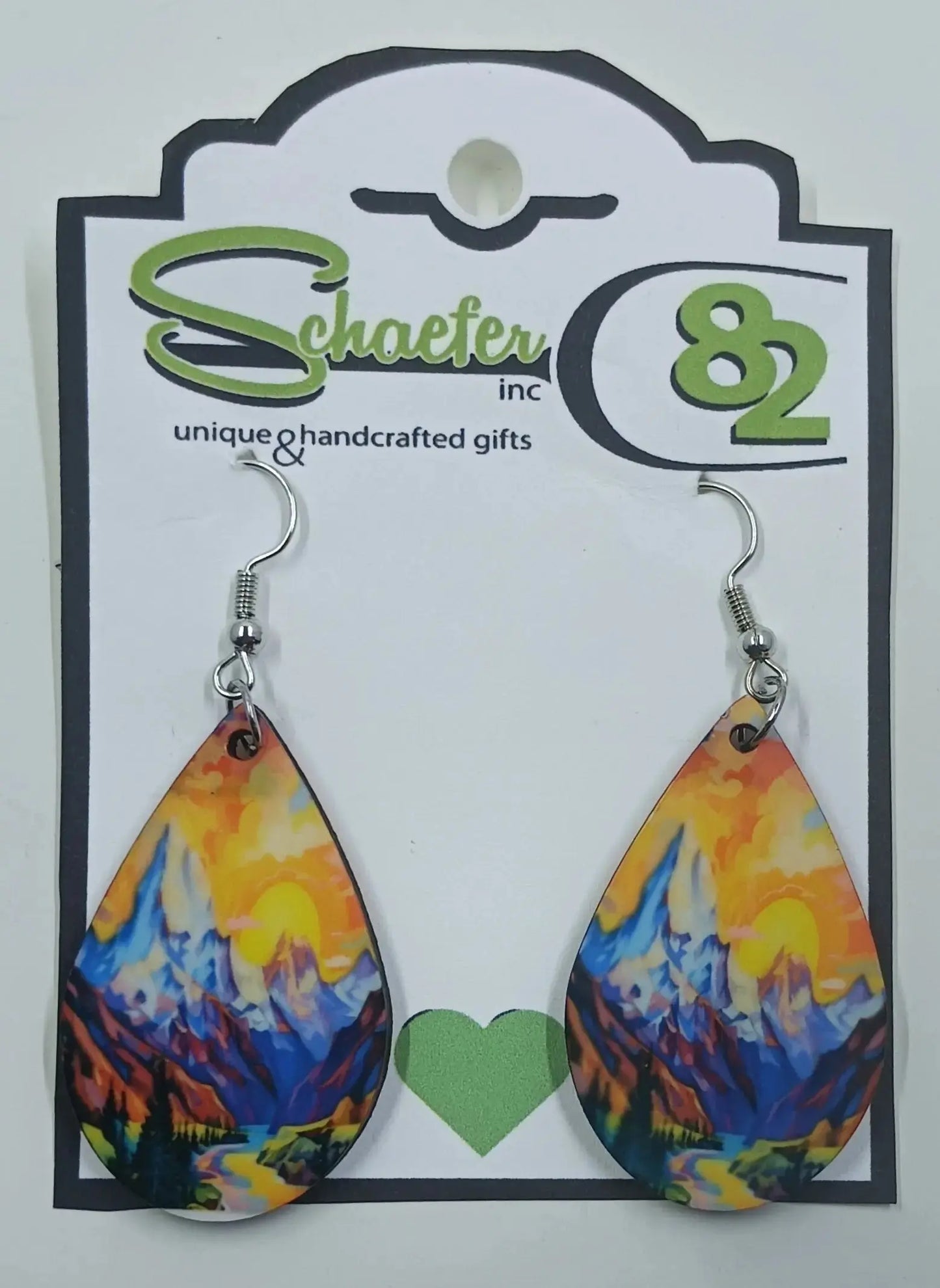 These gorgeous tear drop earrings are brightly colored with a sunset and mountains in the forefront within a little valley.