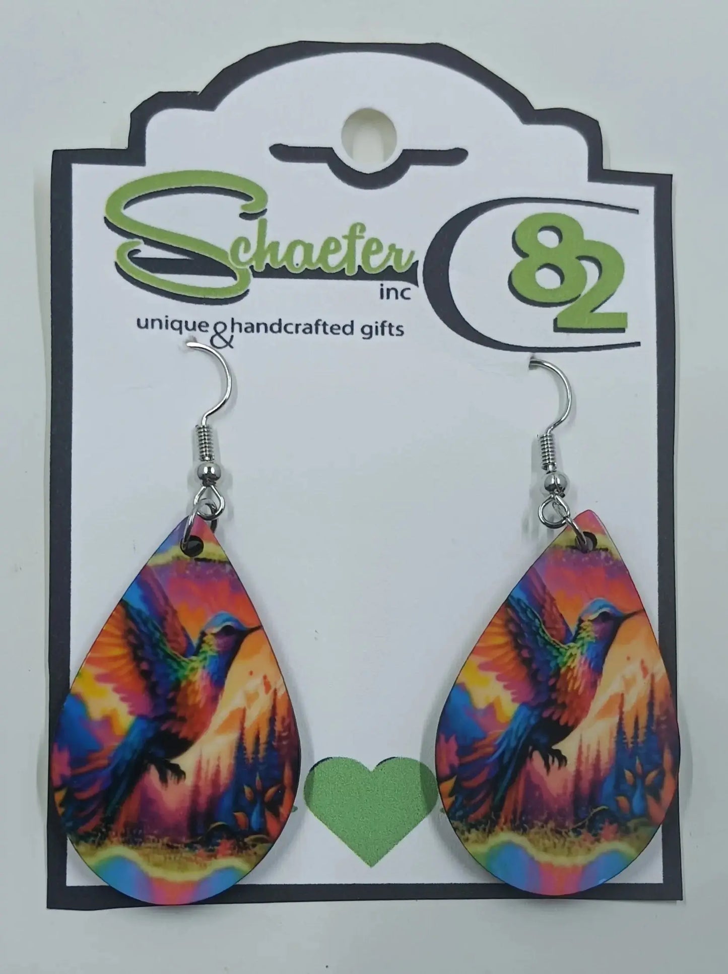 Unique earrings with colorful humming birds, the colorful forest and a bright orange and yellow sunset