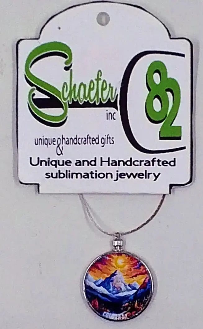 This colorful mountain necklace has a great image of a colorful sunset and mountains in the forefront.