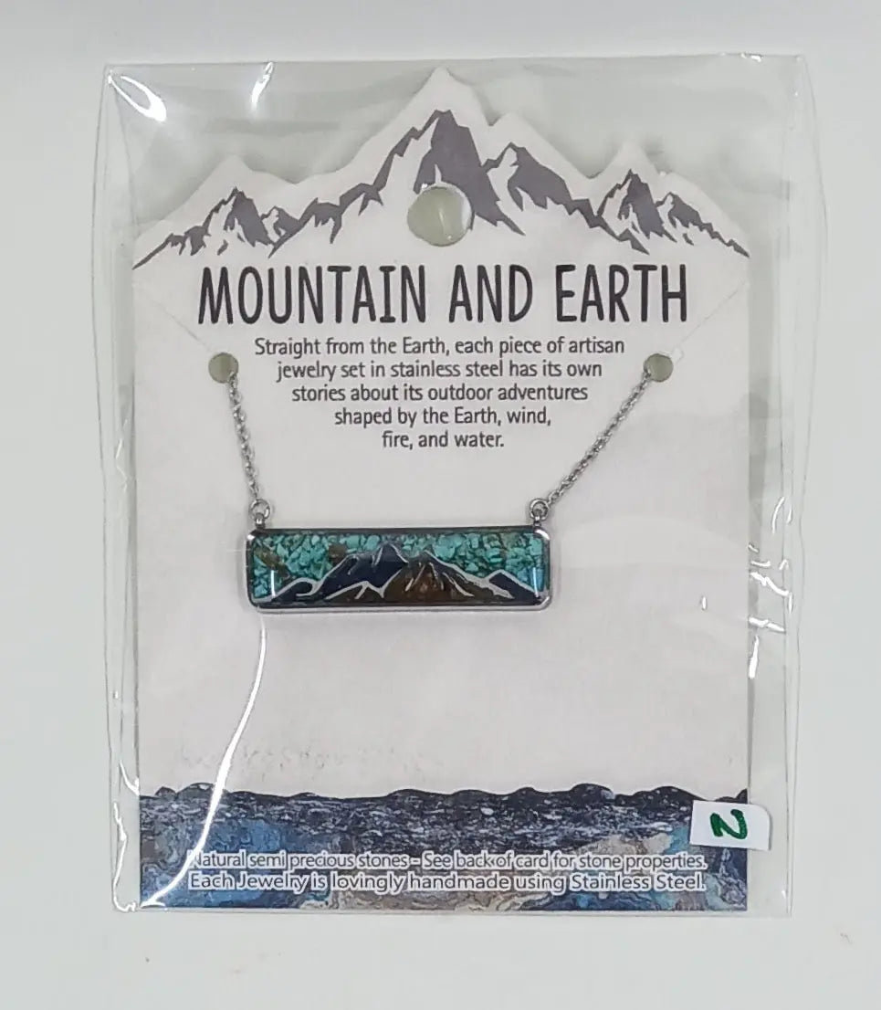sterling silver rectangle necklace with a mountain design and filled with green turquoise, snowflake obsidian and mineral sand semi precious stones