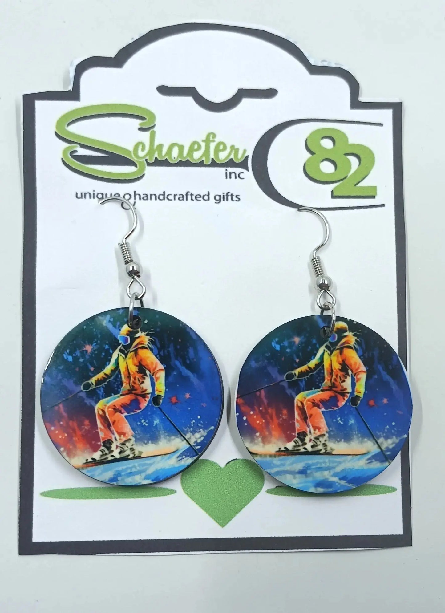 Our skiing earrings are a great addition to any skiers wardrobe. They are colorful and vibrant and has a skier actively going down the mountain.