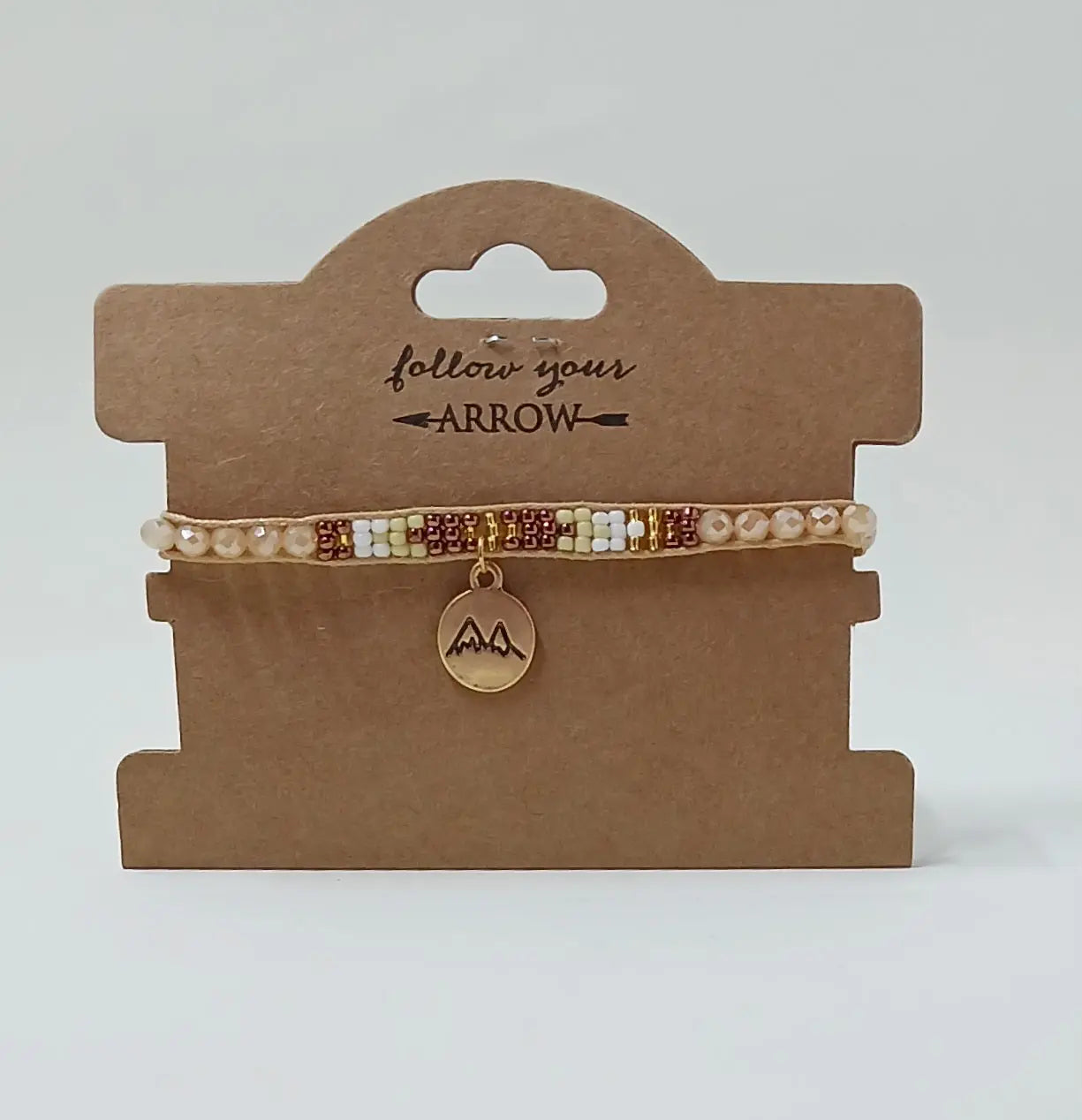 tan and gold beaded bracelet with mountains Round The Mountain Gift Shop