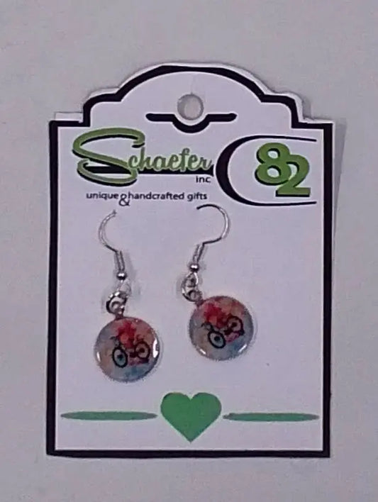 These colorful and fun earrings are small but have a rainbow like background with a bike in the forefront. 