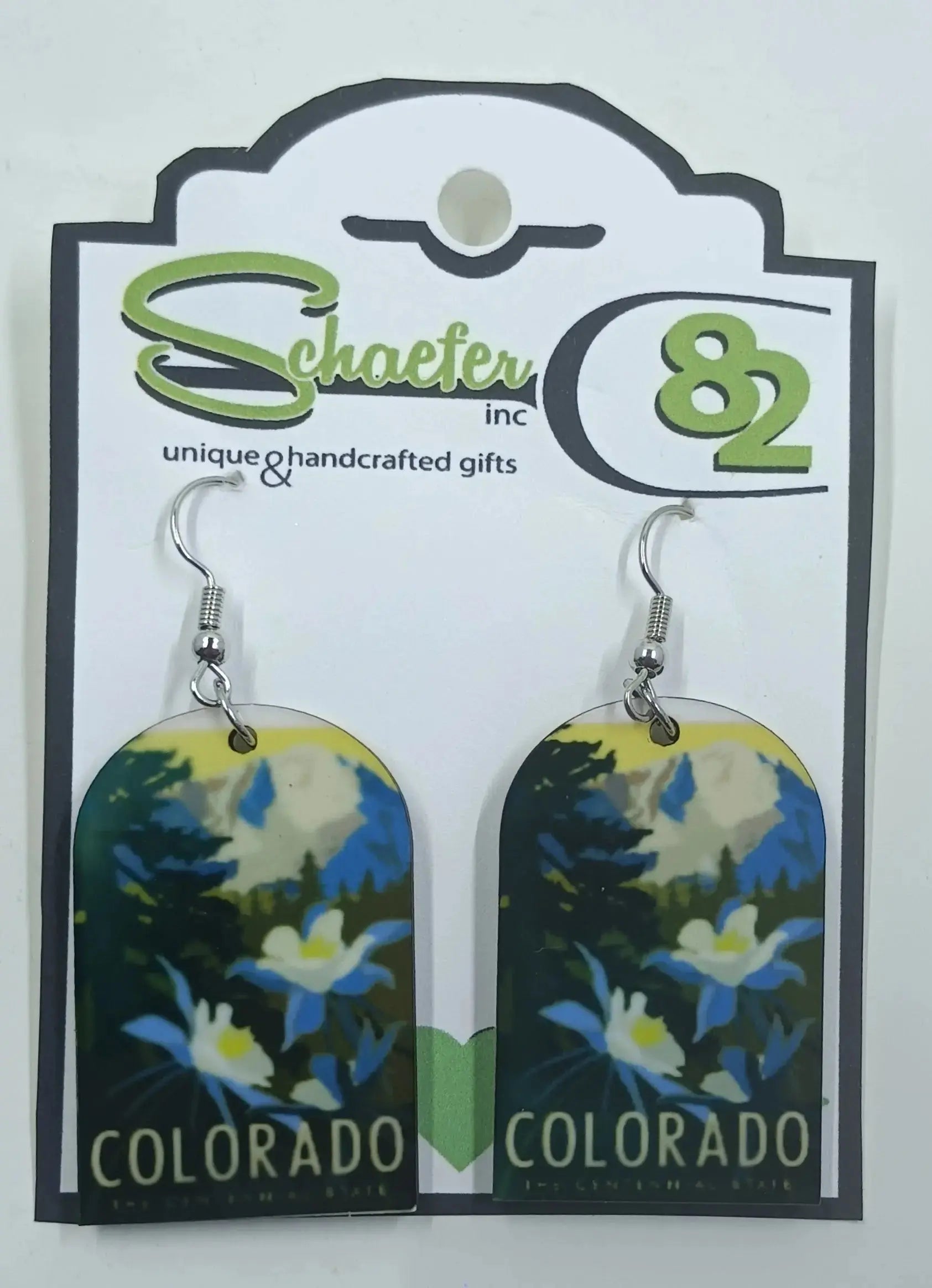Colorado Earrings that have beautiful mountains and columbine flowers. It says Colorado across the bottom:round the mountain gift shop
