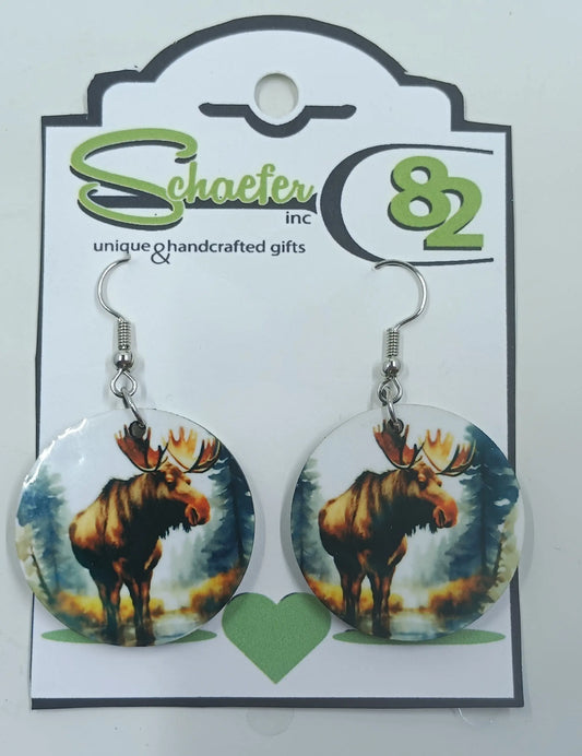 Round Moose Earrings with the forest around him. 