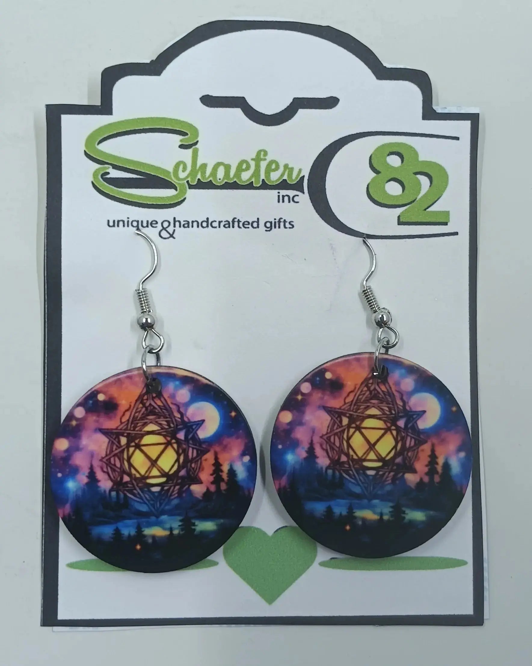 Witch earrings that have northern lights sky and a moon and illuminated pentagram